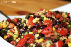Salsa with tomatoes, corn, black beans, olives, green onions, and lime.